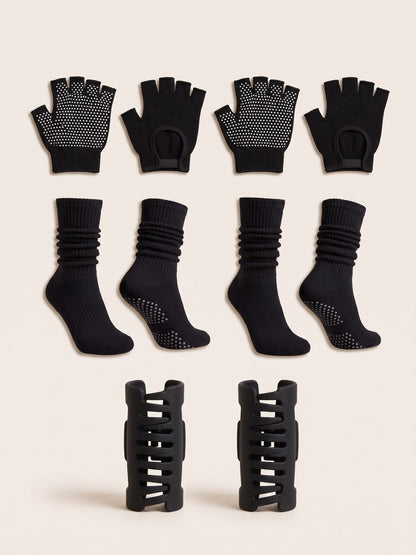 Black gloves, socks and SoftClip 2-Pack laid flat together in matching black