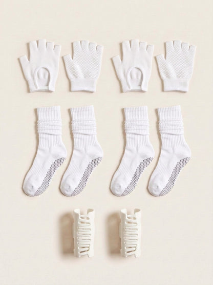 White gloves, socks and SoftClip 2-Pack laid flat together in matching white