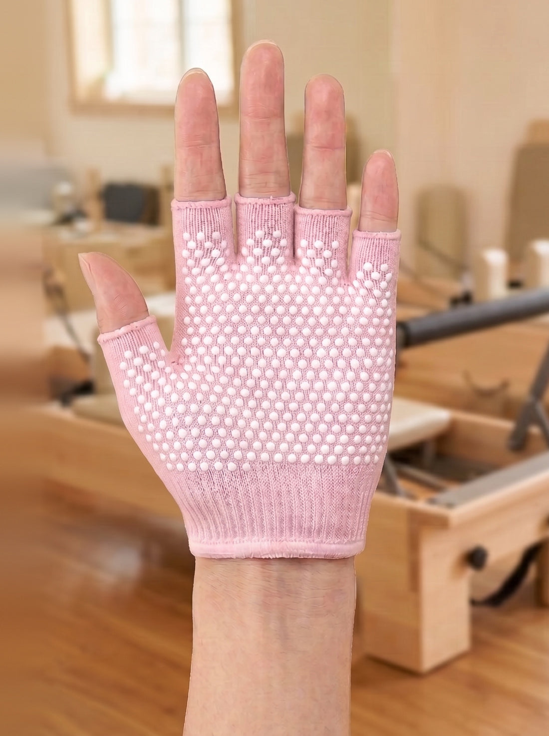 A bare, damp palm before wearing the glove